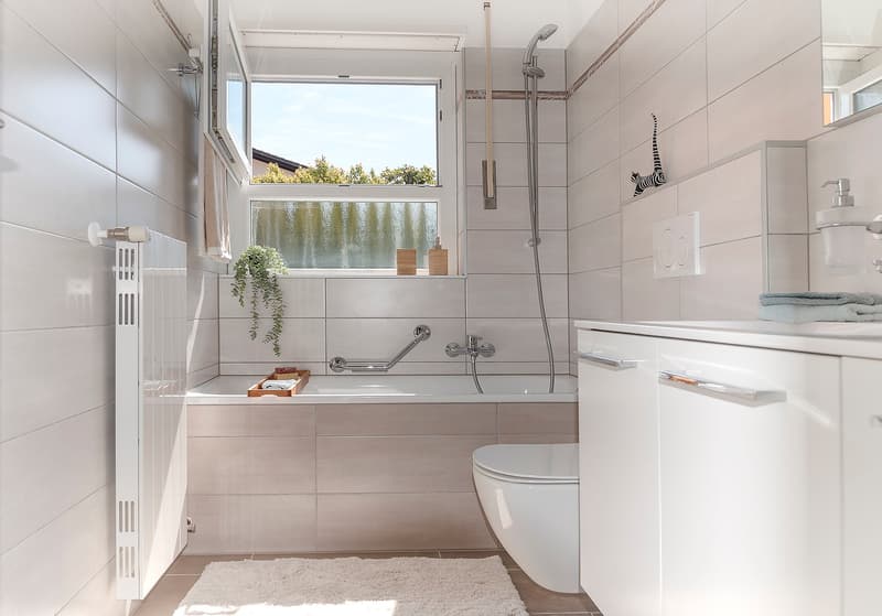modern bathroom, white tiles, bathtub, toilet, sink, shower, window