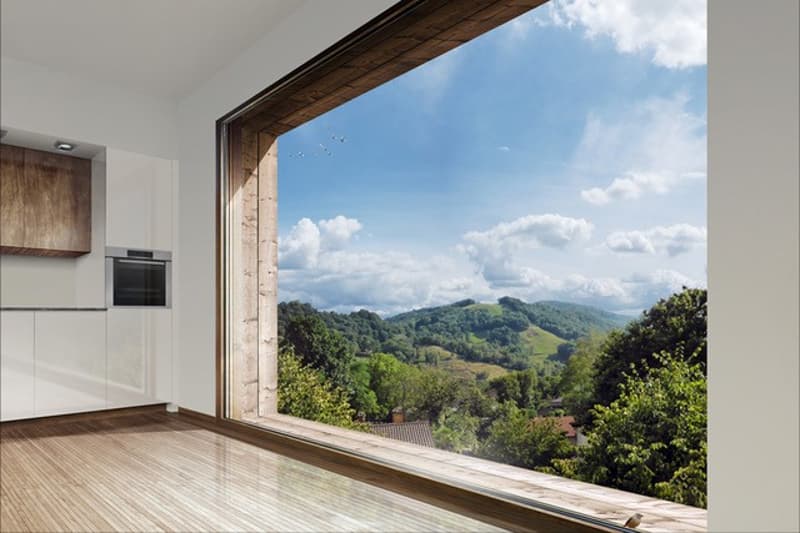 Wooden floor, large panoramic window with view of the hills