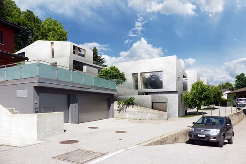 two story concrete house, garage, stairs, road