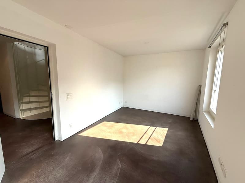 white walls, brown floor, open door, open window, sunlight