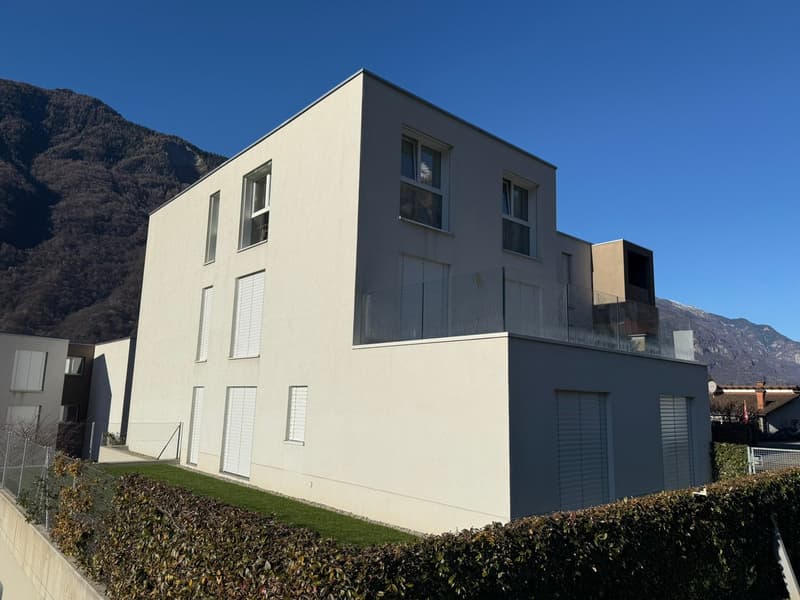 white exterior, large windows, balcony, mountain view