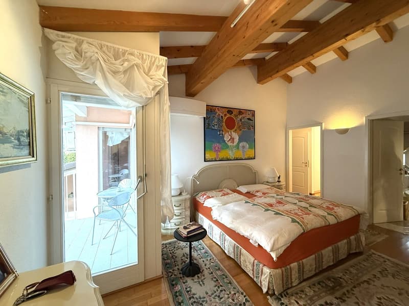 bed, nightstands, nightstand lamps, wall painting, carpet, terrace