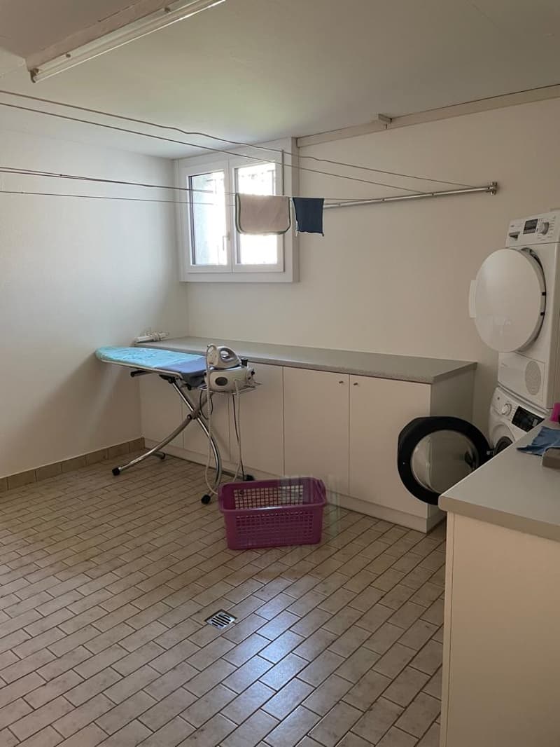 tiled floor, white walls, iron board, iron, washing machine, dryer, basket, windows