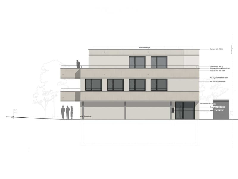 2-story commercial or office building with a flat roof, large windows, and a balcony on the second floor.