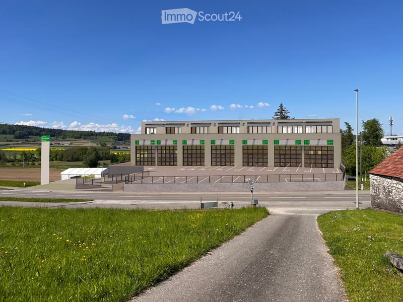 Large building with multiple windows, large parking lot, wide driveway