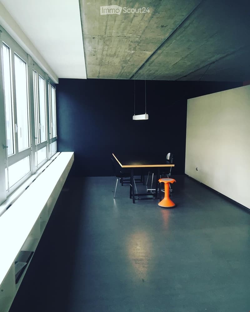 empty room with table, chairs, bench and windows