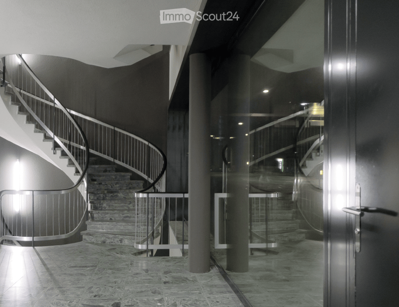 modern spiral staircase, marble flooring, glass doors