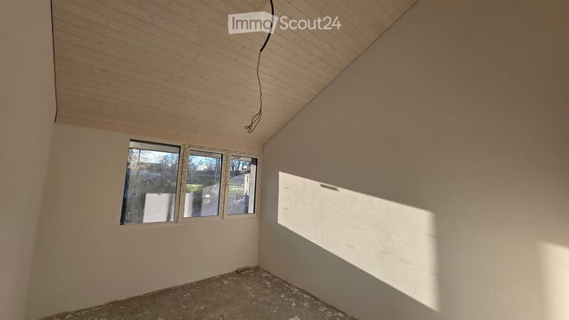 empty room, white walls, wooden ceiling, two windows, concrete floor
