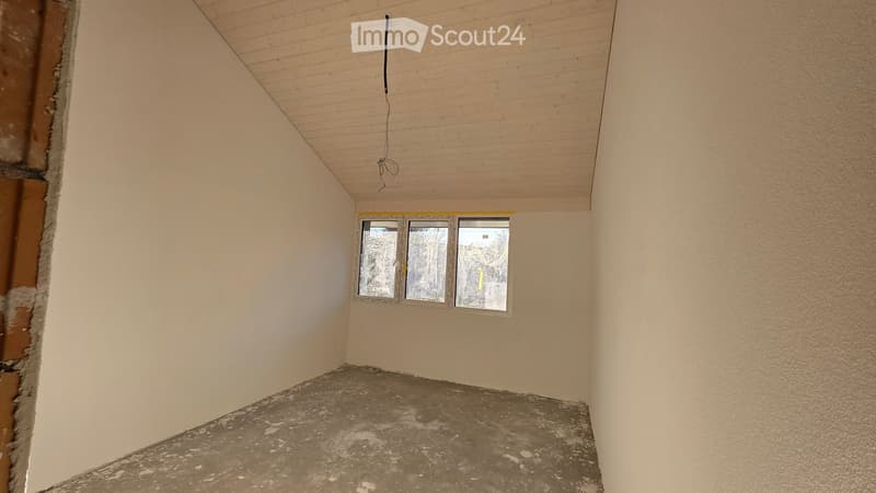 empty room, white walls, concrete floor, two windows, unfinished ceiling