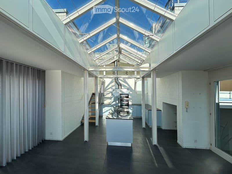 glass roof, open kitchen, stainless steel sinks, wooden stairs, white tiles, open space