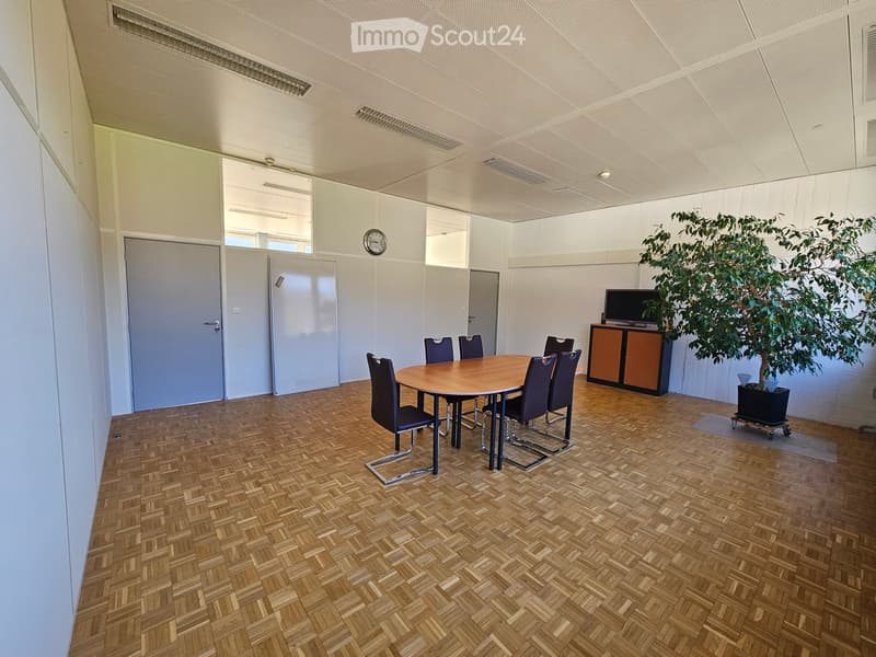 empty room, hardwood parquet floor, round dining table, 8 chairs, wooden cabinet, TV, potted plant, clock, double doors