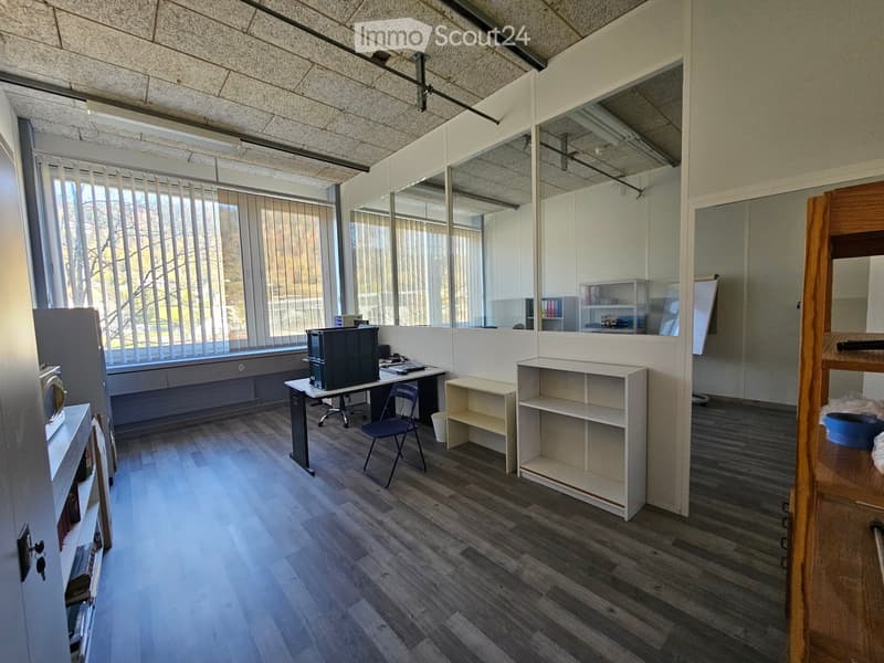 Wooden floor, large windows, office table, bookshelves, chairs, whiteboard, large mirrors