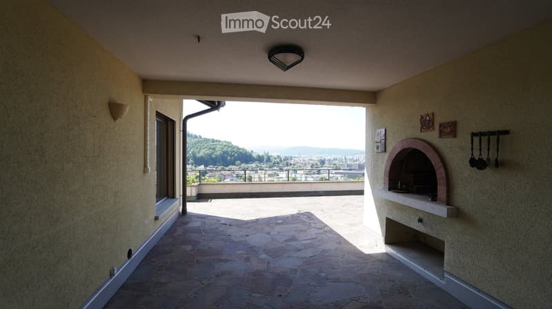 Stone flooring, light fixture, outdoor fireplace, city view, balcony