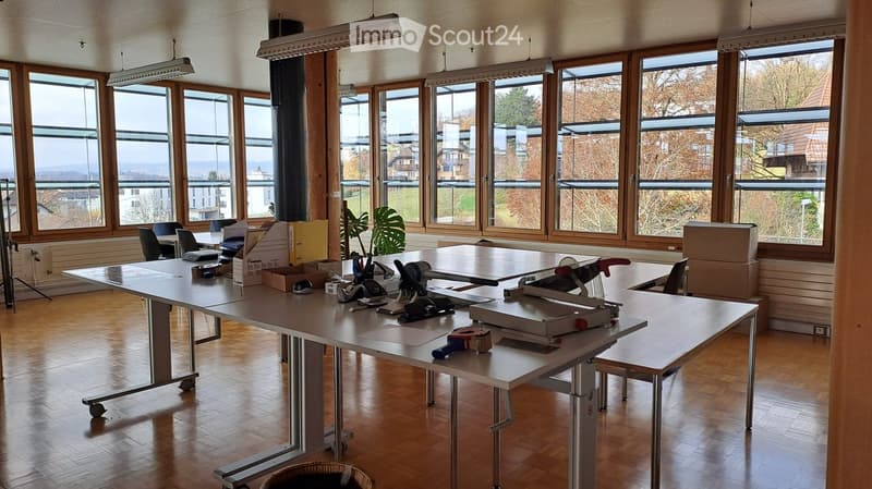 office space with multiple desks, chairs, windows