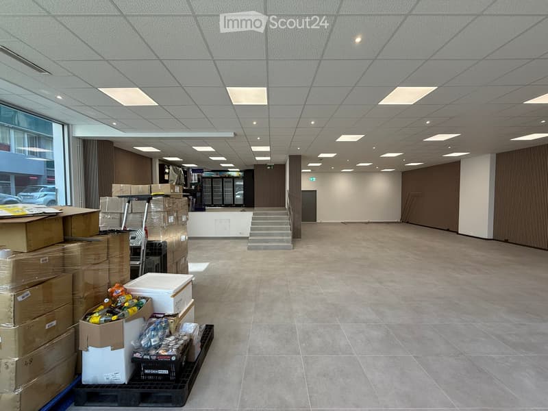 empty room, tiled floor, white ceiling, boxes, ladder, stairs