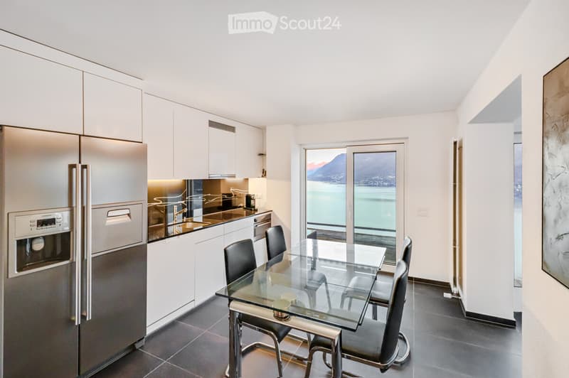 modern kitchen, granite countertops, stainless steel appliances, glass table, sliding door
