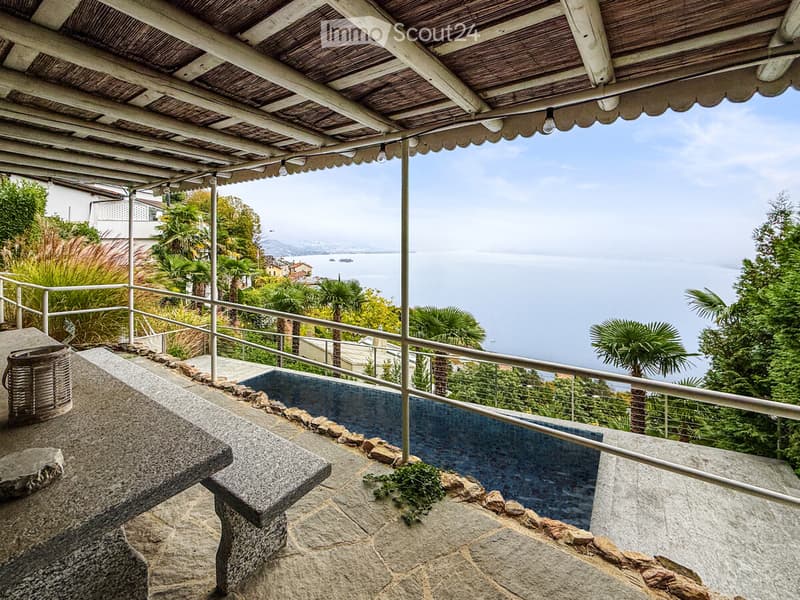 Balcony with canopy, stone bench, small pool, ocean view