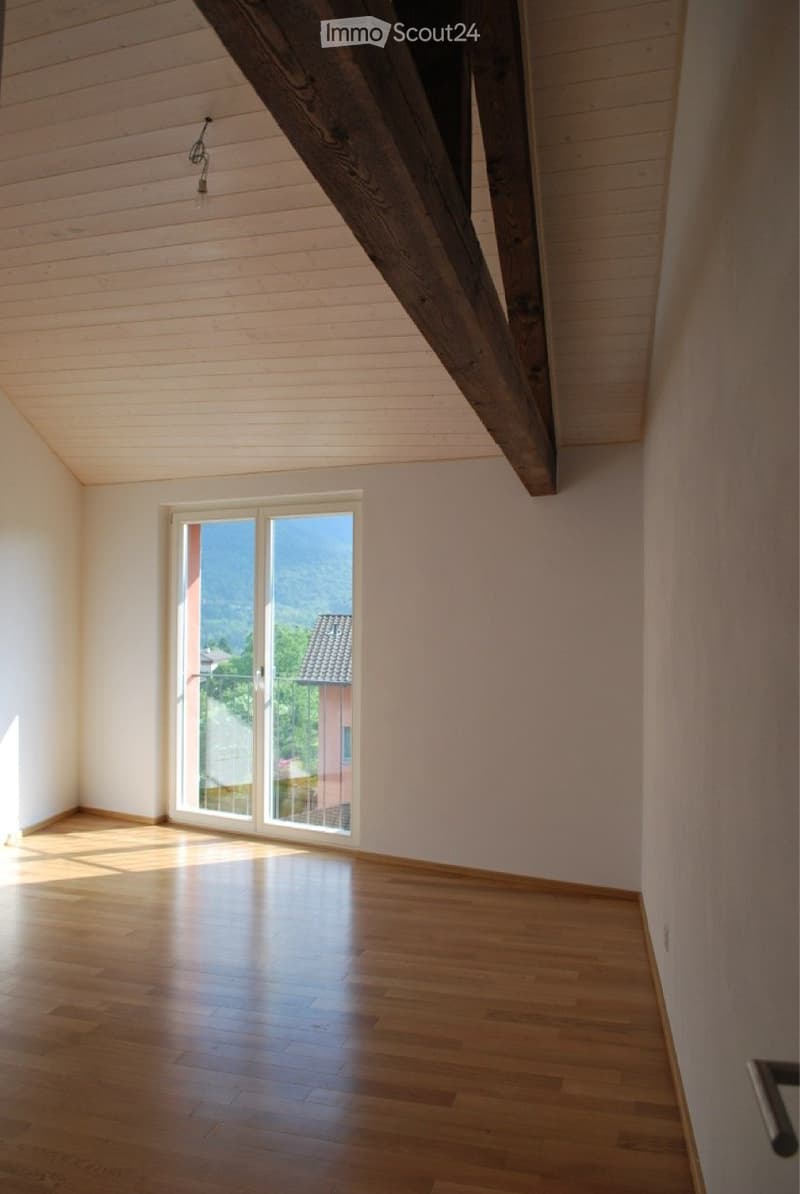 large windows, balcony, wooden floor