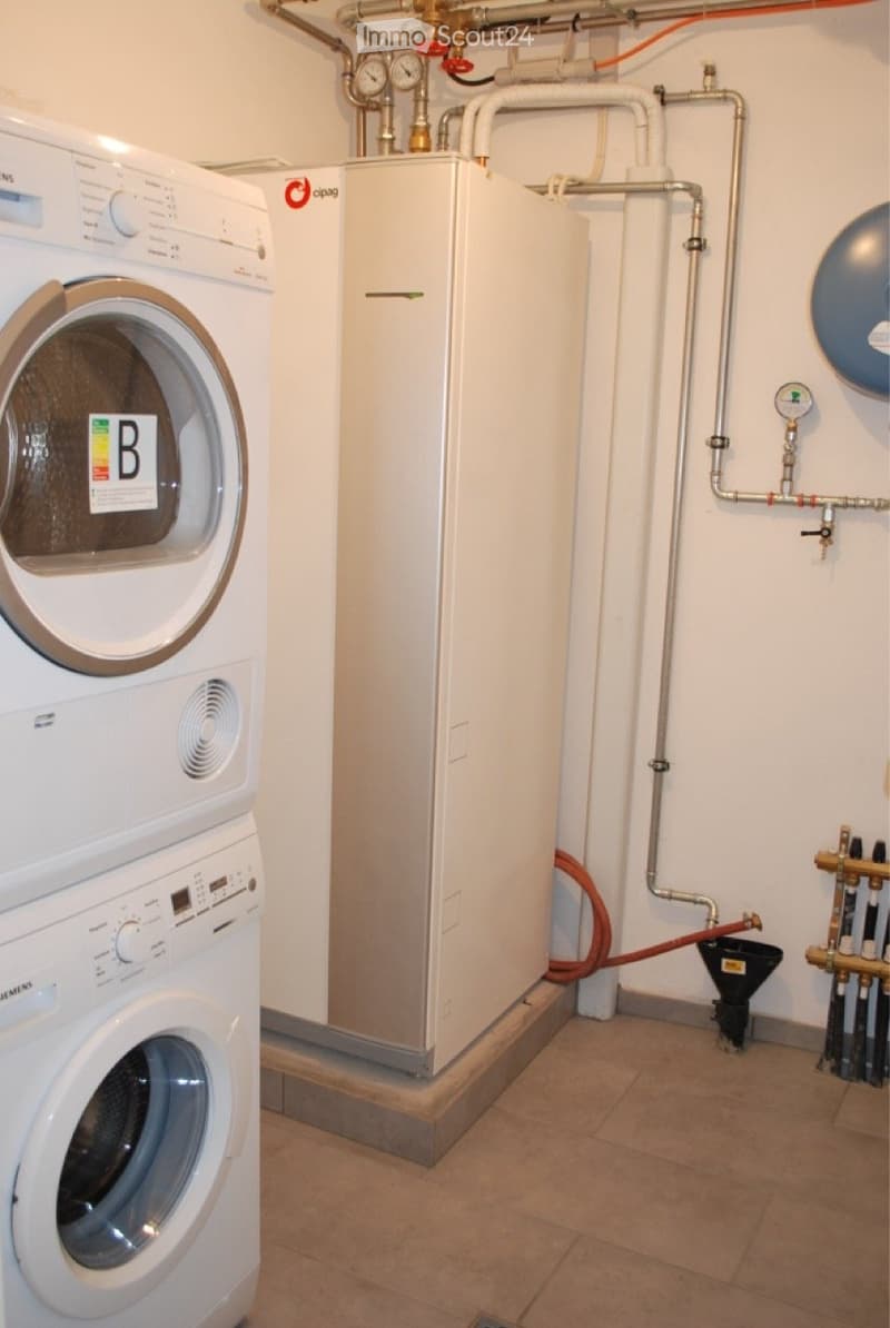 white washing machine, white dryer, pipes, metal container