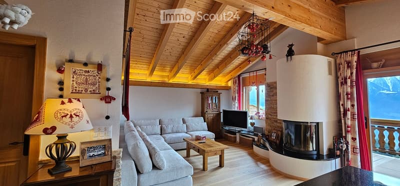 wood ceiling, fireplace, sectional sofa, coffee table, tv, open balcony