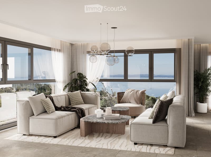white sofas, round coffee table, chandelier, rug, glass sliding doors, sea view