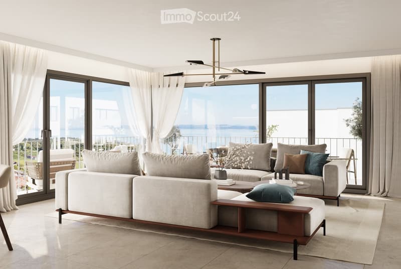large windows, double doors to balcony, two sofas, center table, wooden table