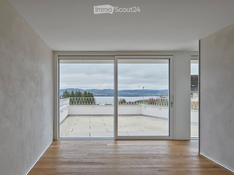 sliding glass doors, wooden floor, balcony with fence, glass railings, panoramic view
