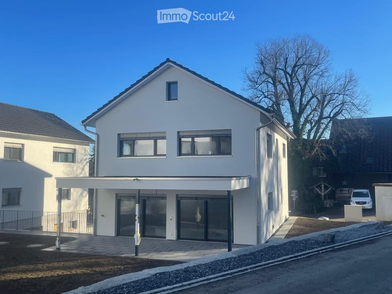 2 story house, white exterior, large windows, garage