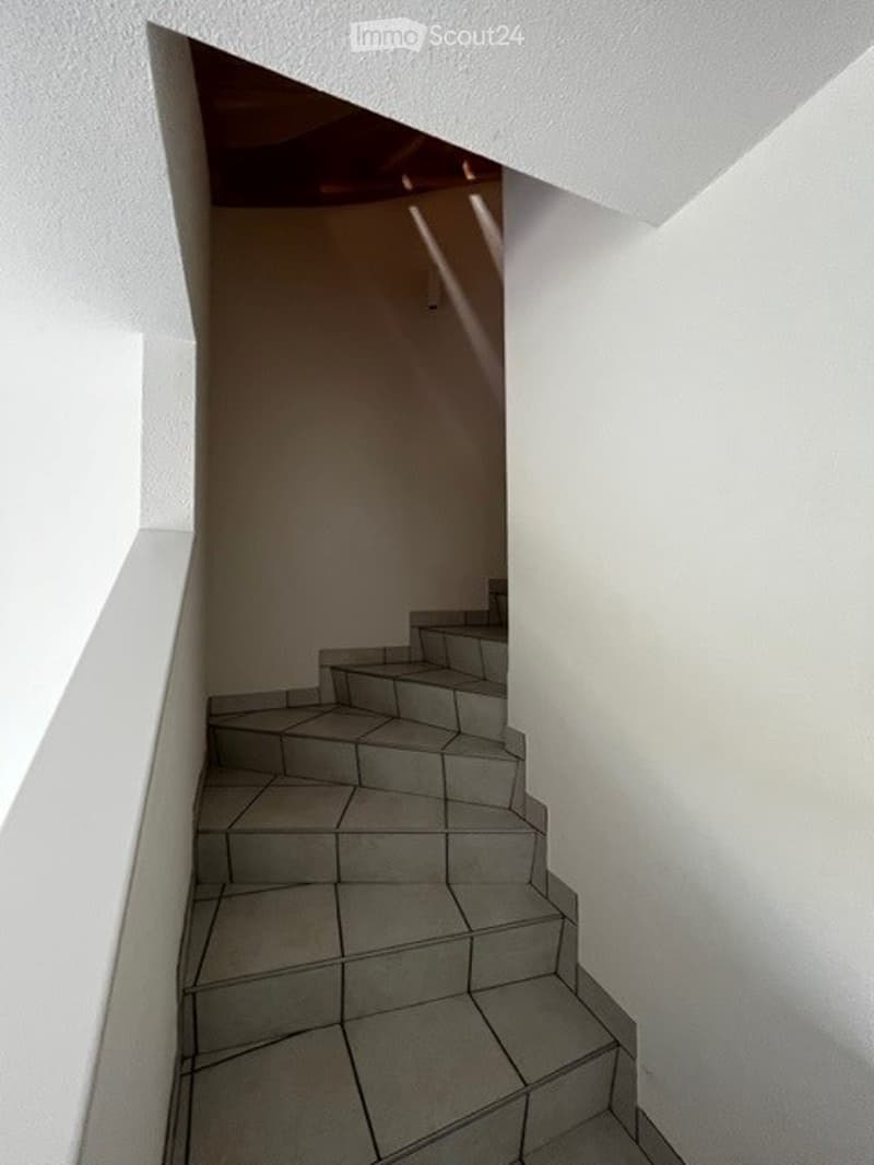 modern tile steps, white walls, slanted roof