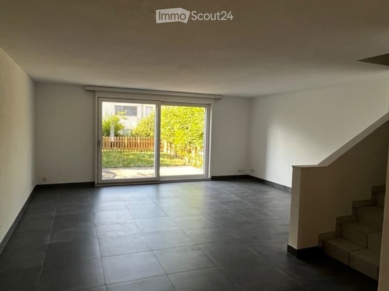 Empty room with sliding glass doors leading to a terrace