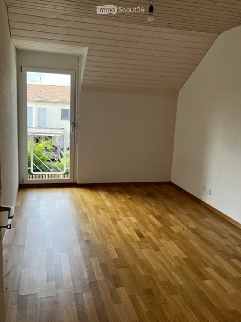 empty room with glass door and balcony, wooden floor, white walls