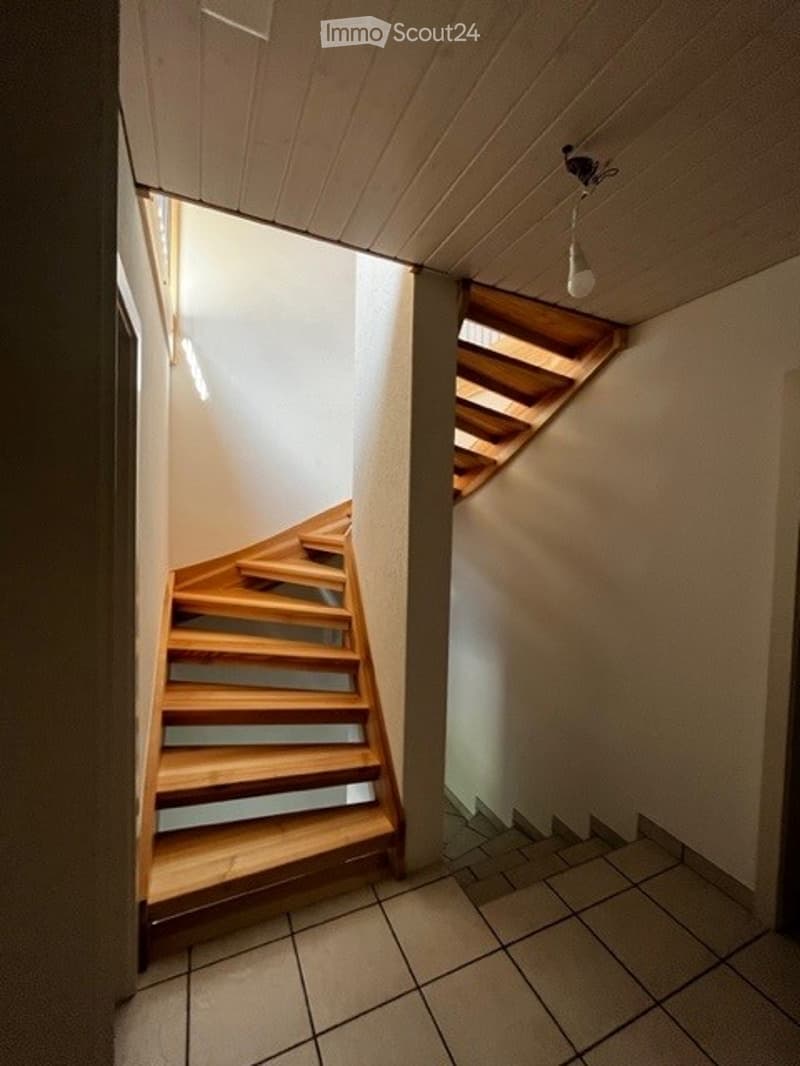 wooden staircase, white tiled floor, white walls