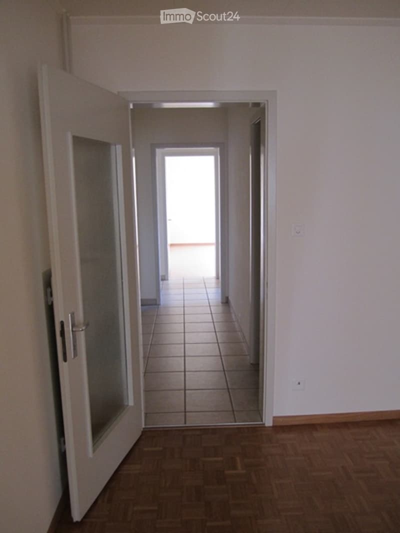 Open window on the ceiling, tiled wall, glass door, wooden wall, white walls