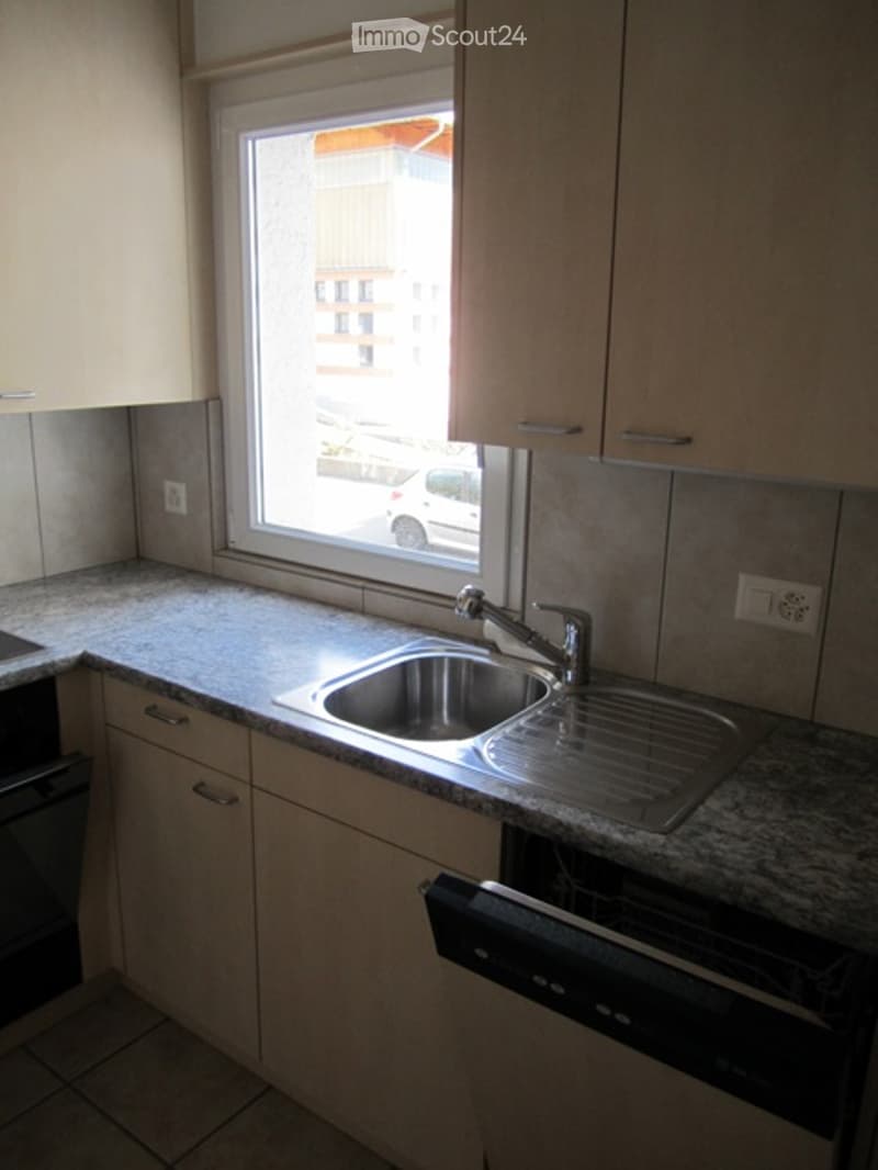 kitchen with sink, faucet, and dishwasher