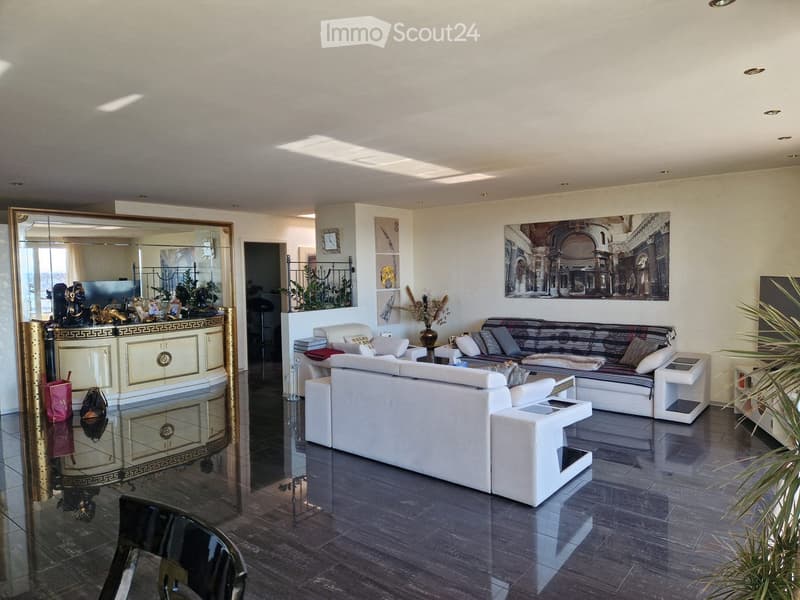 modern living room, white couches, large windows, large mirror, white walls, plants, artwork