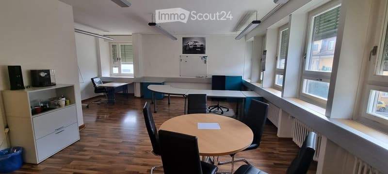 conference room, long white table, chairs, radiators, picture on wall