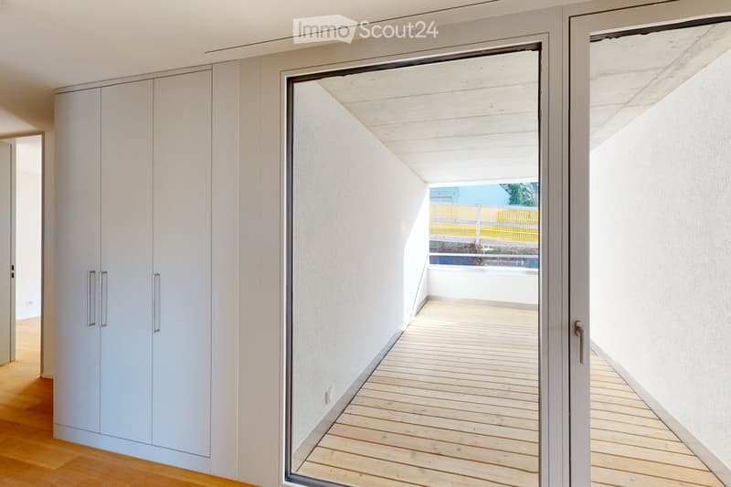 Corridor leading to a balcony, large windows, wooden floor, white walls, modern closet