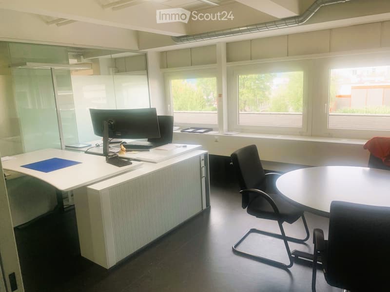 Glass walls, computer desk, chairs, round table, black chairs, glass windows