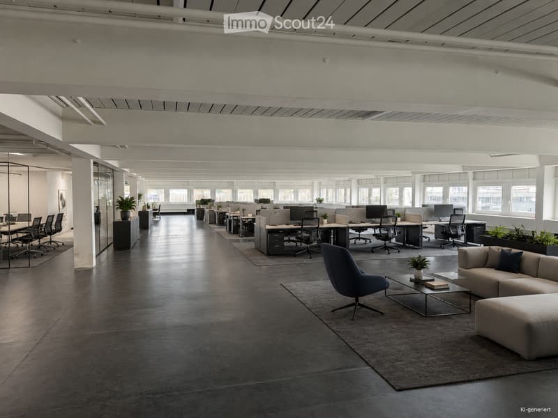 Modern office space with open-plan workstations, desks, chairs, and a lounge area featuring a sofa, coffee table, and chairs.