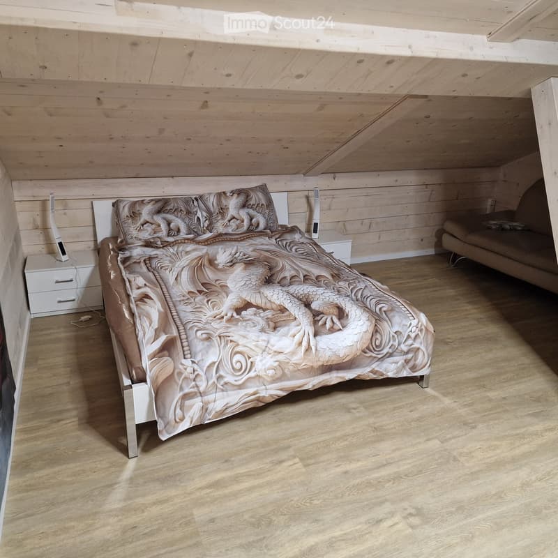 bedroom with bed, night tables, and couch