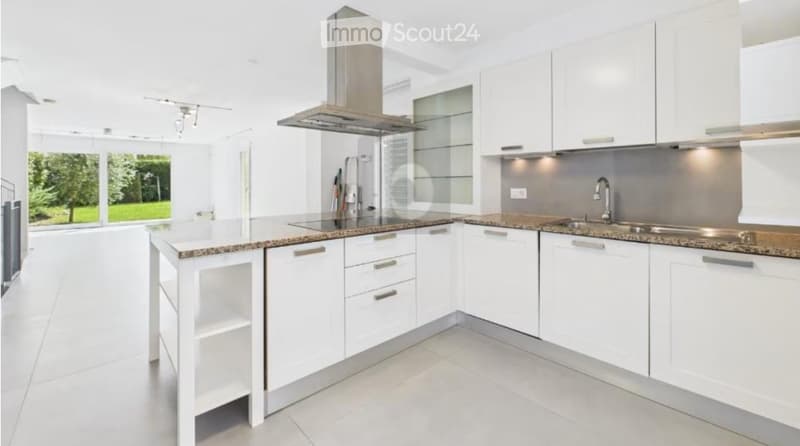 Modern kitchen, white cabinets, stainless steel appliances, granite countertops, integrated dishwasher and washing machine