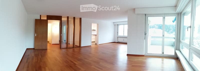 hardwood floor, white walls, sliding glass doors, balcony, panoramic view