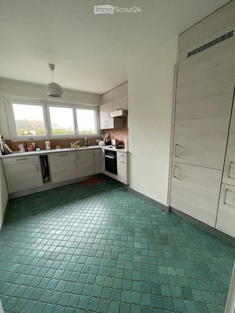 kitchen, green tiled floor, white cabinets, sink, faucet, microwave, refrigerator, cabinets, drawers, windows