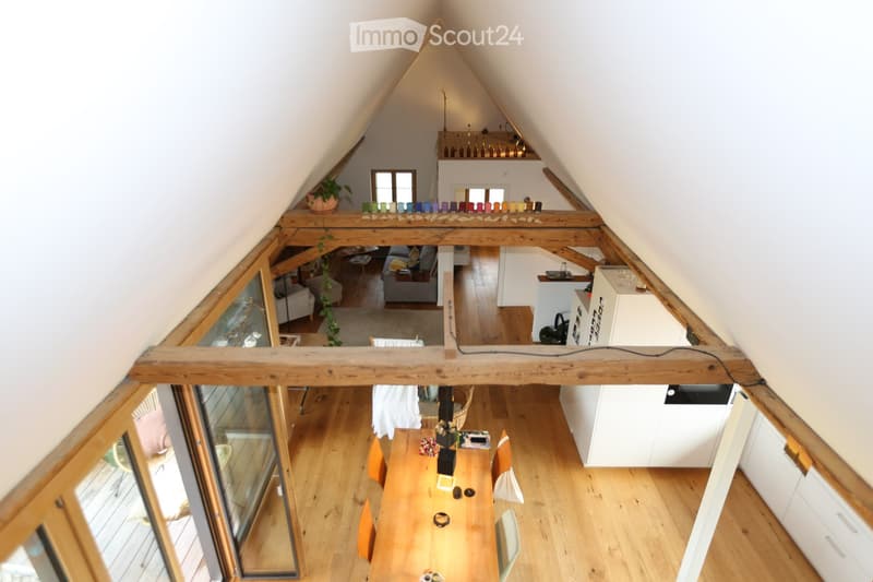 open plan kitchen, living and dining area, wooden beams, skylights, white cabinets, chandelier