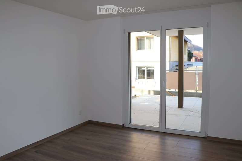empty room, white walls, wooden floor, sliding glass door, balcony outside