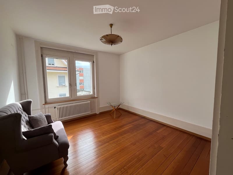empty room, wooden floor, white walls, glass window, sofa, glass table