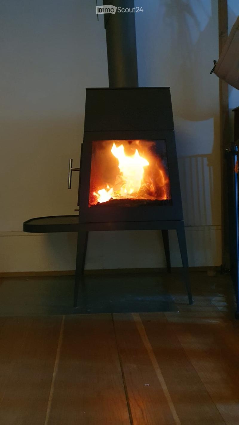 fireplace in center, bright orange flames