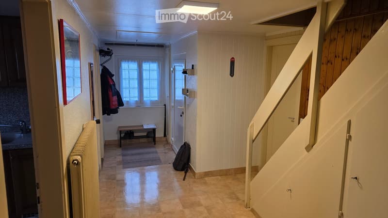 tiles floor, wooden bench, radiator, mirror, windows, staircase
