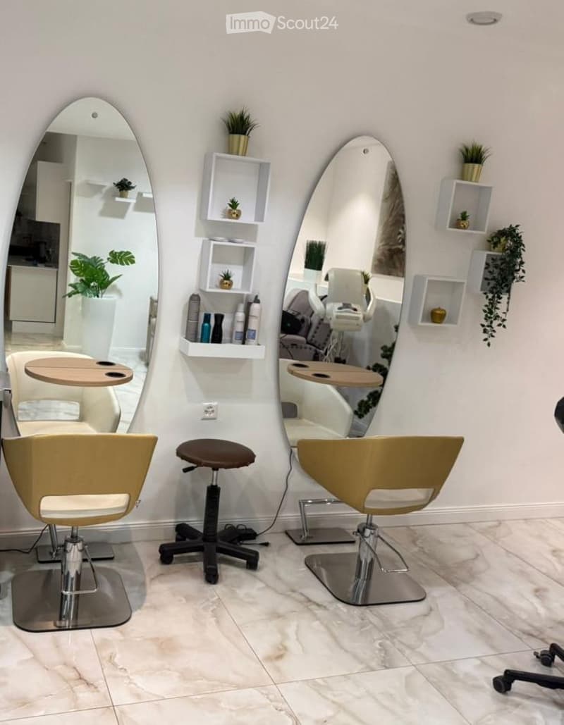 Salon chair, mirror, table, plant, tiled floor, shelf with plants