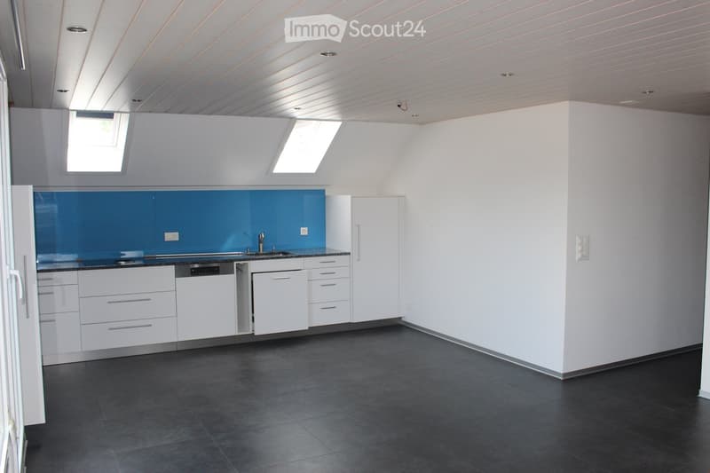 kitchen area, white cabinets, blue backsplash, tiled floor, sink, dishwasher, white ceiling, two skylights